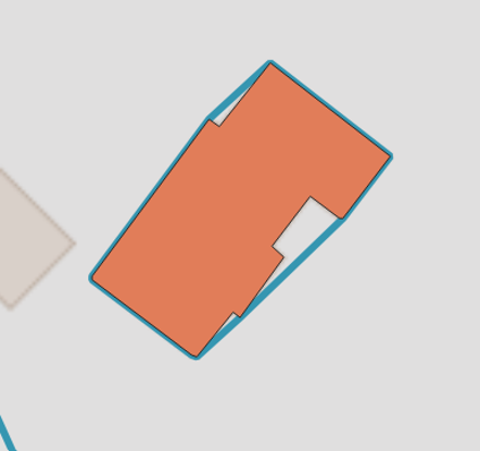 Exemple de la géométrie d&rsquo;un bâtiment (en orange) et de son enveloppe convexe (en bleu).